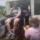 A program participant in a wheelchair being lowered from a bus